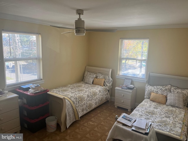 bedroom featuring ceiling fan and crown molding