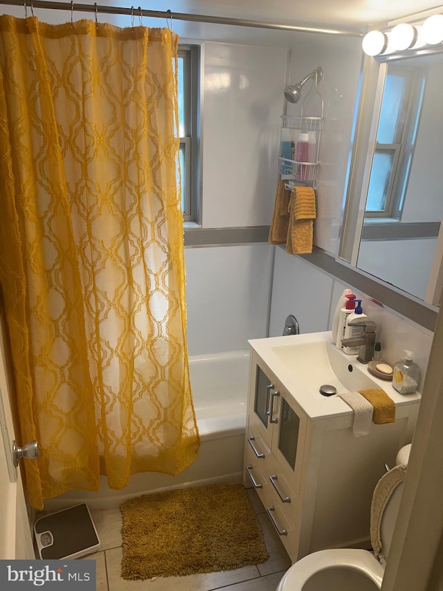 full bath featuring tile patterned flooring, toilet, shower / bath combo with shower curtain, and vanity