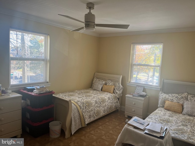 bedroom with ceiling fan and crown molding