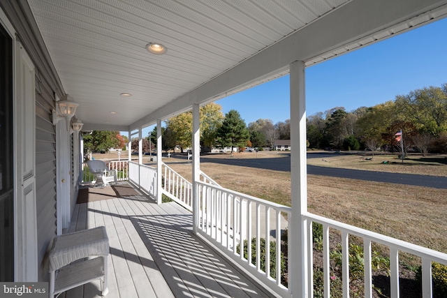 wooden terrace with a porch