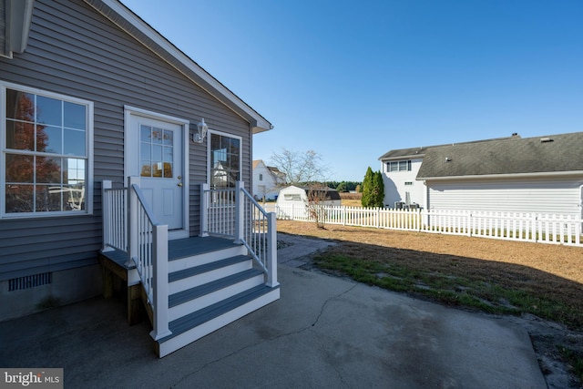 entrance to property with a patio area