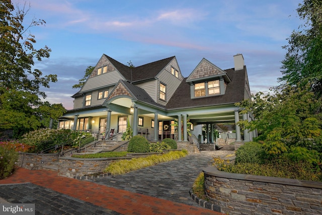 155 E Oakland Ave, Doylestown, PA 18901 - back of property at dusk featuring a chimney and covered porch