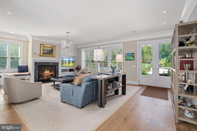 155 E Oakland Ave, Doylestown, PA 18901 - living room with french doors, wood finished floors, healthy amount of natural light, a high end fireplace, and ornamental molding