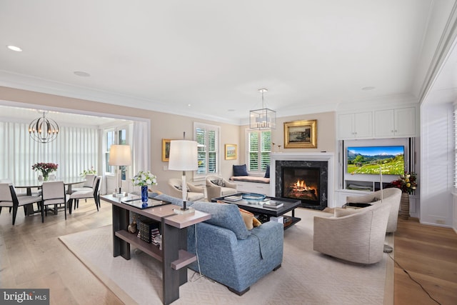 155 E Oakland Ave, Doylestown, PA 18901 - living room featuring a chandelier, a premium fireplace, ornamental molding, light wood-style floors, and recessed lighting