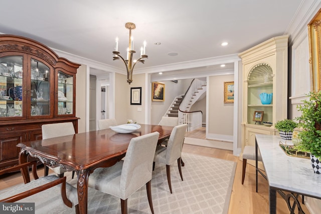 155 E Oakland Ave, Doylestown, PA 18901 - dining area featuring a chandelier, stairway, crown molding, light wood finished floors, and baseboards