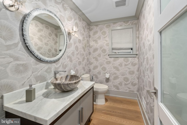 155 E Oakland Ave, Doylestown, PA 18901 - bathroom featuring toilet, wallpapered walls, wood finished floors, vanity, and baseboards