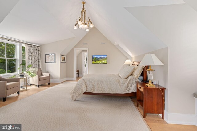 155 E Oakland Ave, Doylestown, PA 18901 - bedroom featuring light wood-type flooring, baseboards, vaulted ceiling, and a chandelier