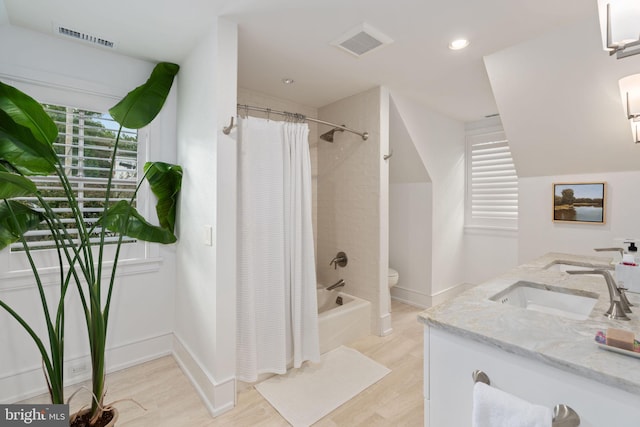 155 E Oakland Ave, Doylestown, PA 18901 - bathroom with shower / bathtub combination with curtain, wood finished floors, toilet, double vanity, and baseboards