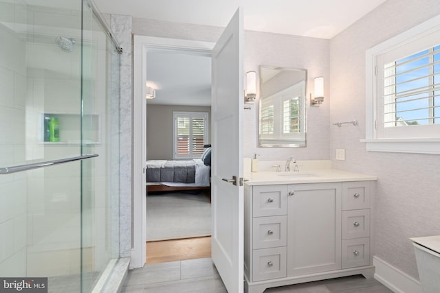 155 E Oakland Ave, Doylestown, PA 18901 - ensuite bathroom featuring vanity, a shower stall, and wood finished floors