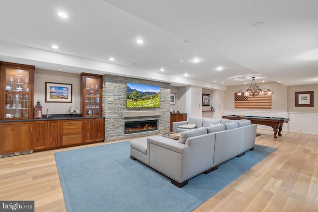 155 E Oakland Ave, Doylestown, PA 18901 - living room with light wood finished floors, pool table, recessed lighting, a fireplace, and a wainscoted wall