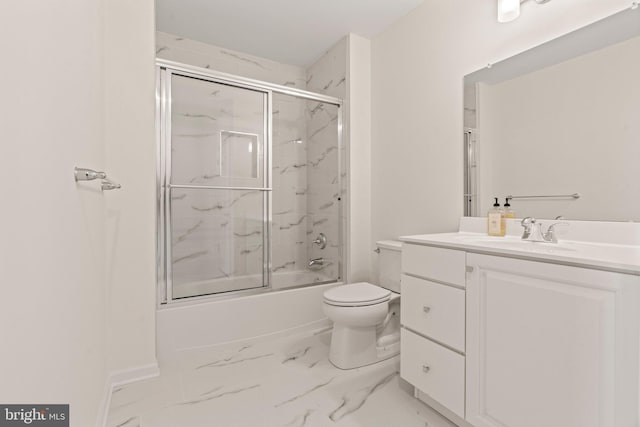full bath with toilet, marble finish floor, baseboards, bath / shower combo with glass door, and vanity