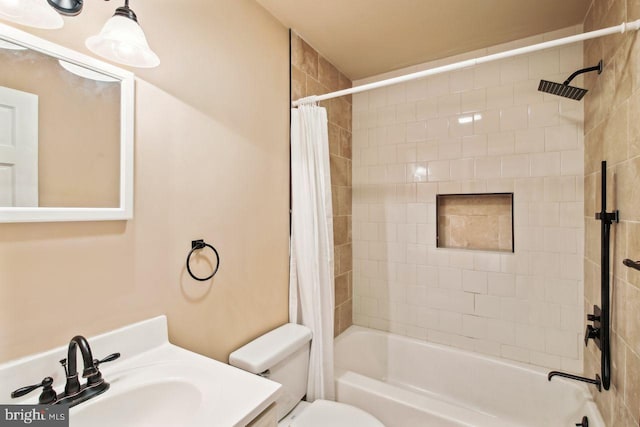 full bathroom with toilet, vanity, and shower / bath combination with curtain