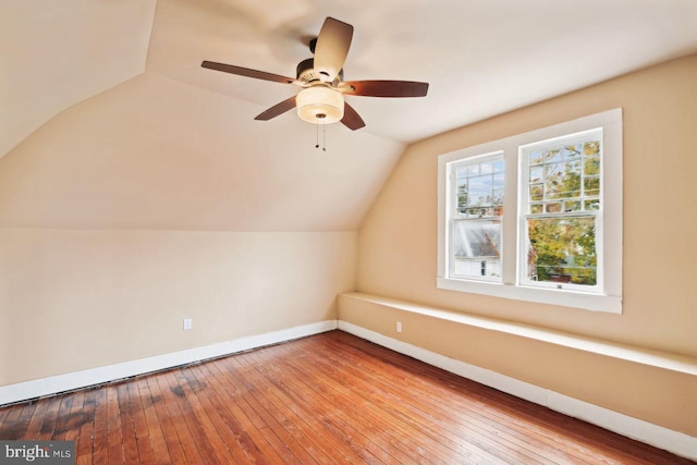 bonus room with light wood-type flooring, ceiling fan, and vaulted ceiling