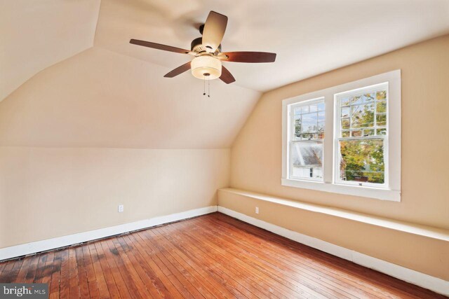 205 Walnut St, Pocomoke City, MD 21851 - additional living space featuring baseboards, vaulted ceiling, ceiling fan, and hardwood / wood-style flooring