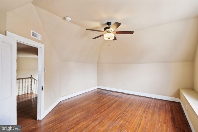 additional living space with lofted ceiling, hardwood / wood-style floors, and ceiling fan