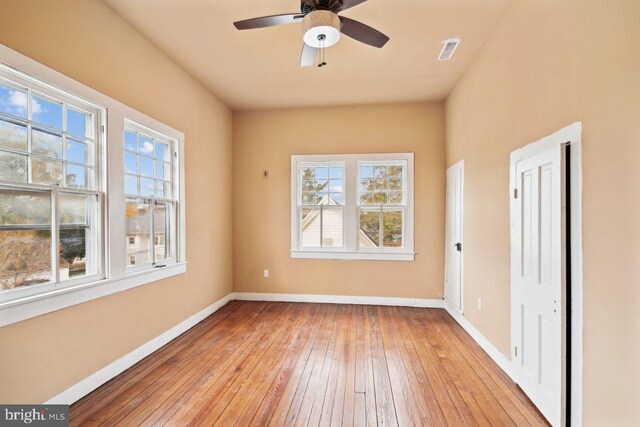 205 Walnut St, Pocomoke City, MD 21851 - spare room featuring light wood finished floors, healthy amount of natural light, baseboards, and a ceiling fan
