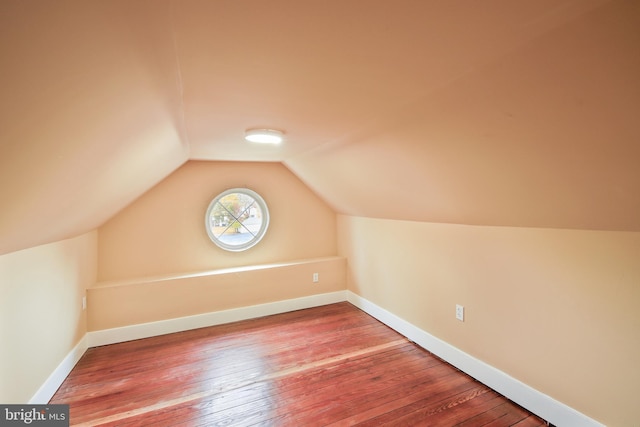 205 Walnut St, Pocomoke City, MD 21851 - additional living space featuring wood-type flooring, lofted ceiling, and baseboards