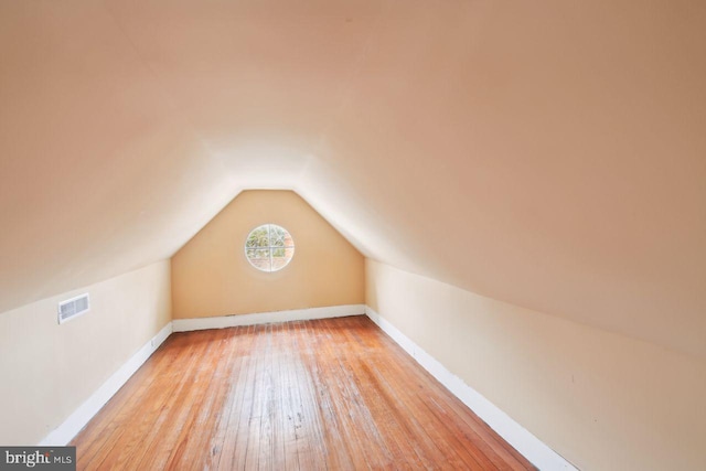 205 Walnut St, Pocomoke City, MD 21851 - bonus room with hardwood / wood-style flooring, vaulted ceiling, and baseboards