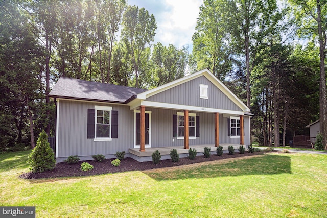 view of front of house with a front lawn and covered porch