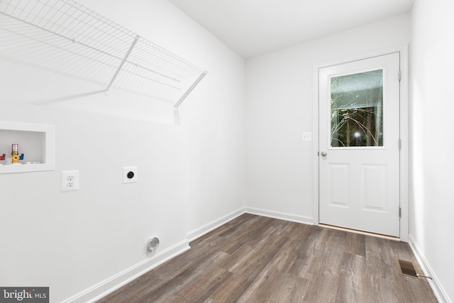 washroom featuring hookup for an electric dryer, dark hardwood / wood-style floors, and washer hookup