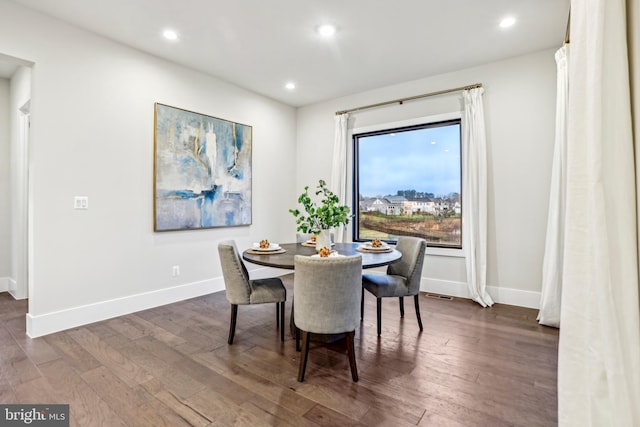 dining area featuring dark hardwood / wood-style flooring