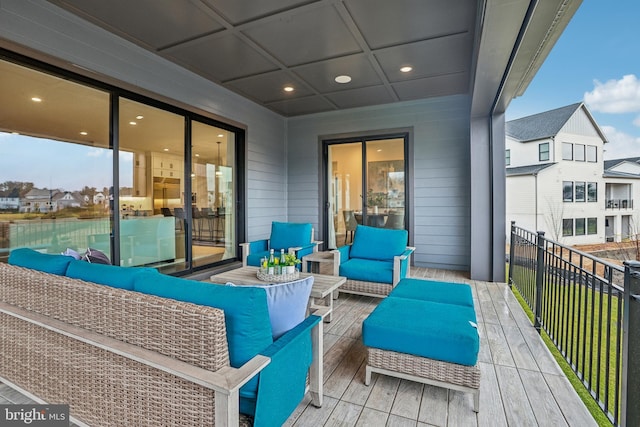 wooden terrace featuring an outdoor hangout area