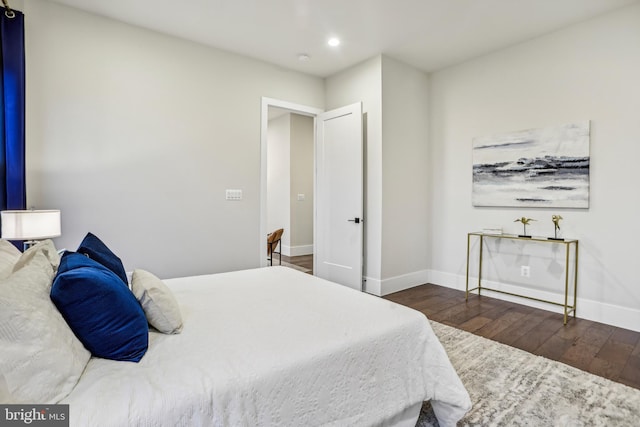 bedroom featuring dark hardwood / wood-style floors