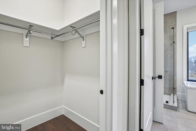 walk in closet featuring light wood-type flooring