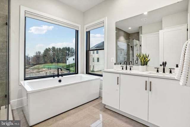 bathroom with vanity, tile patterned floors, and independent shower and bath