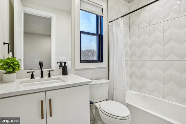 full bathroom featuring vanity, shower / bath combination with curtain, and toilet