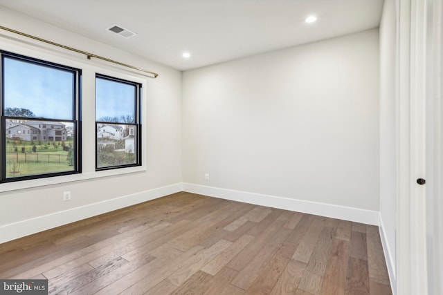 unfurnished room with light hardwood / wood-style flooring