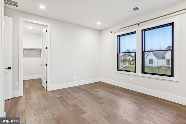 spare room with light wood-type flooring