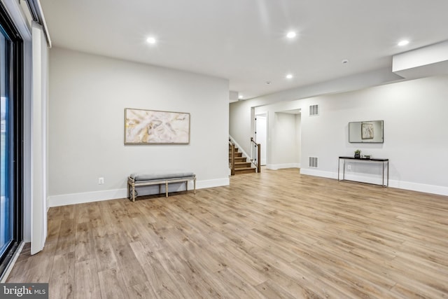 basement featuring light hardwood / wood-style floors