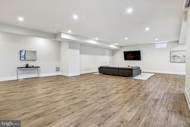 unfurnished living room featuring light wood-type flooring