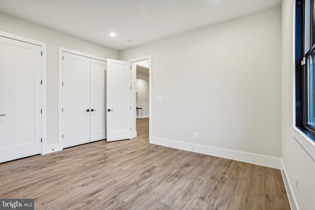 unfurnished bedroom featuring light hardwood / wood-style floors