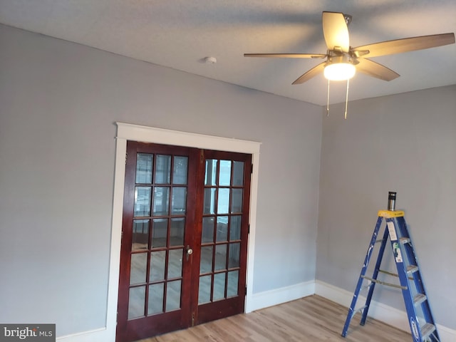 recreation room with ceiling fan and light hardwood / wood-style flooring