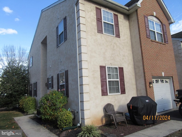 view of side of property with a garage