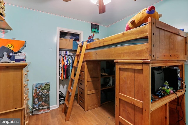 bedroom featuring a closet and wood finished floors