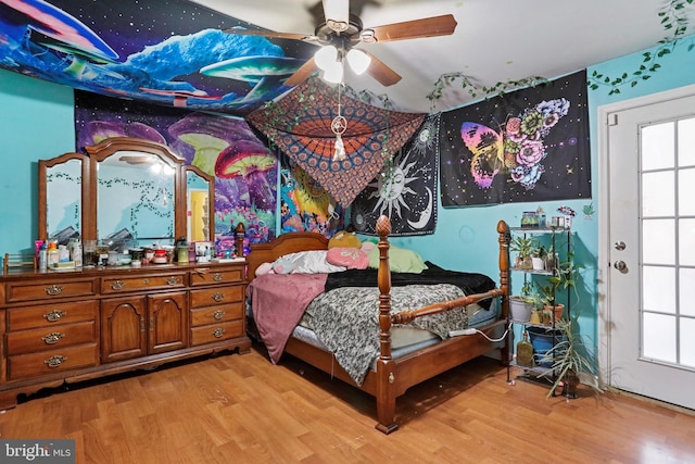 bedroom with ceiling fan and wood finished floors