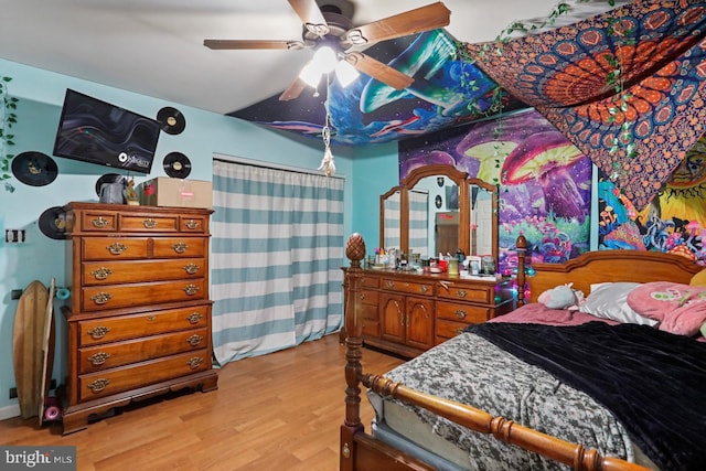 bedroom featuring a ceiling fan and light wood-type flooring