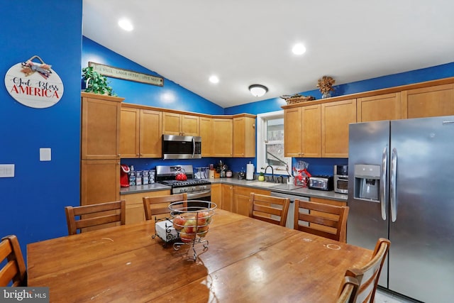 kitchen with recessed lighting, stainless steel appliances, a sink, wood counters, and vaulted ceiling