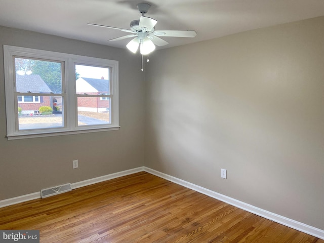 unfurnished room with light hardwood / wood-style floors and ceiling fan