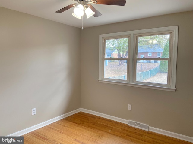 unfurnished room with light hardwood / wood-style flooring and ceiling fan