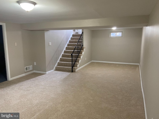 basement featuring carpet flooring