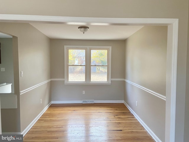 unfurnished room featuring light hardwood / wood-style floors