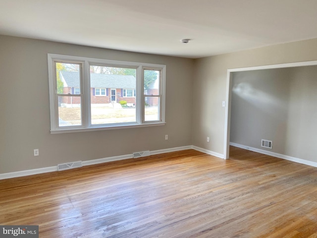 spare room with light hardwood / wood-style flooring