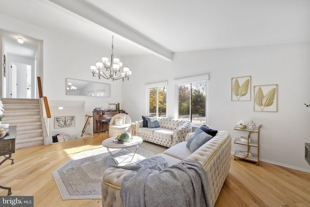 living room with a notable chandelier, light wood-type flooring, and lofted ceiling with beams