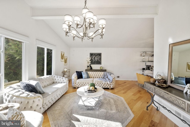 living room with an inviting chandelier, light hardwood / wood-style flooring, and lofted ceiling with beams