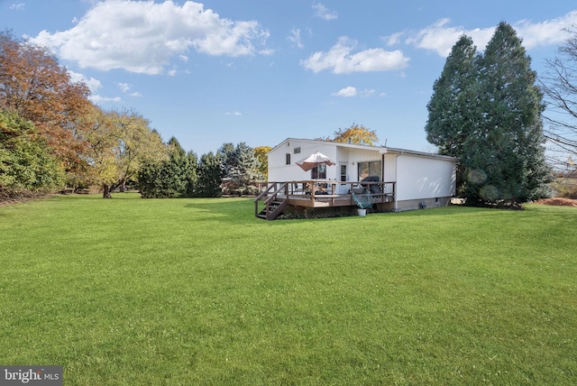 view of yard featuring a wooden deck