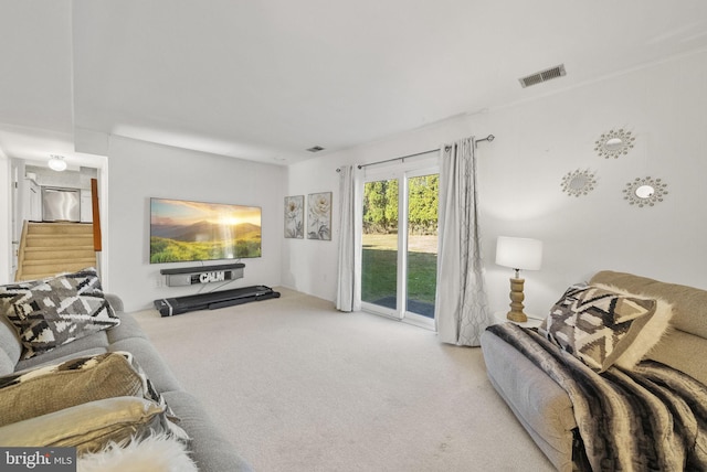 living room featuring light colored carpet